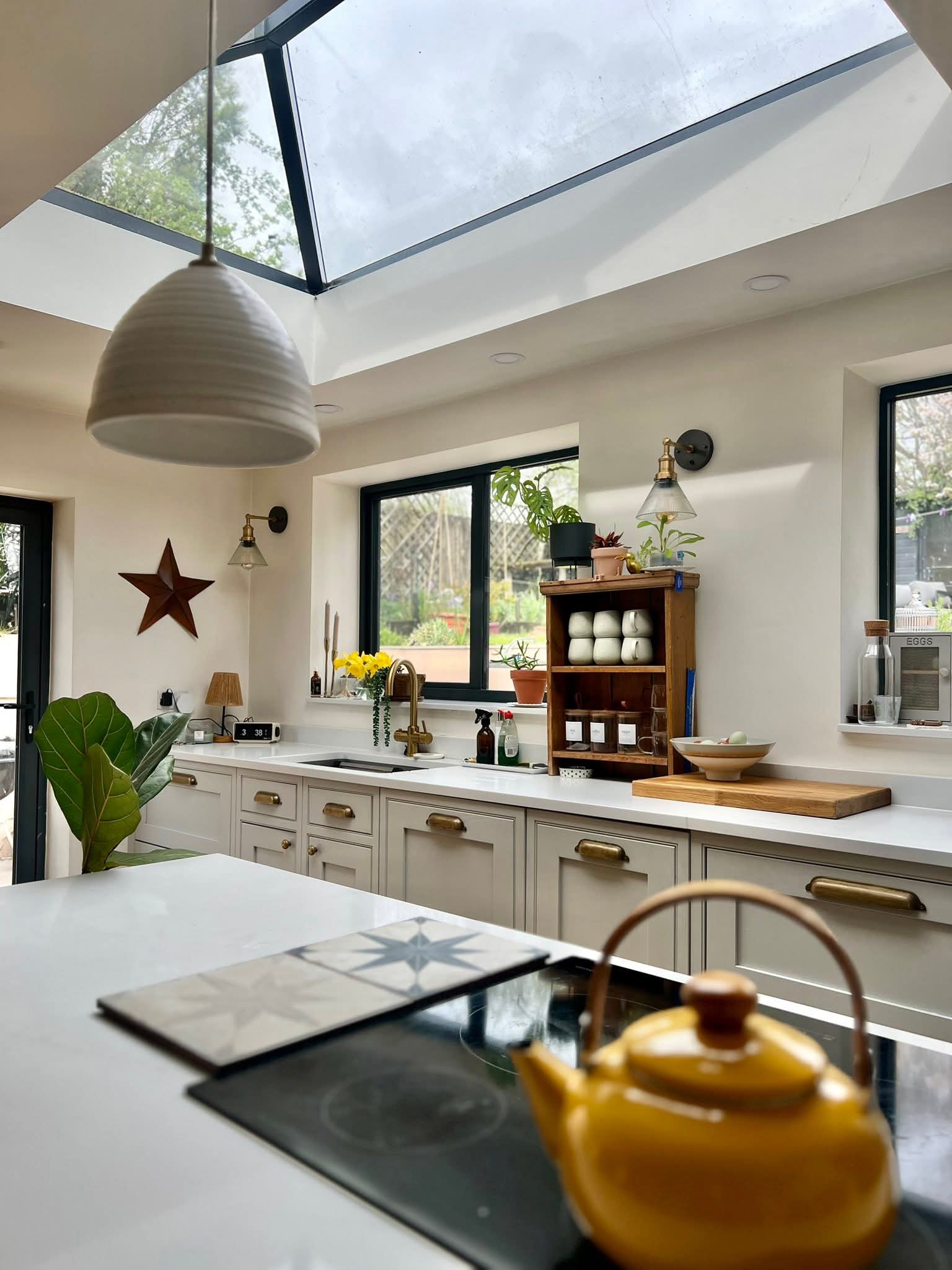 Modern fitted kitchen with wooden cabinets and island